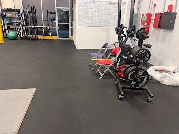Commercial gym floor cleaning in progress at a Jacksonville fitness facility