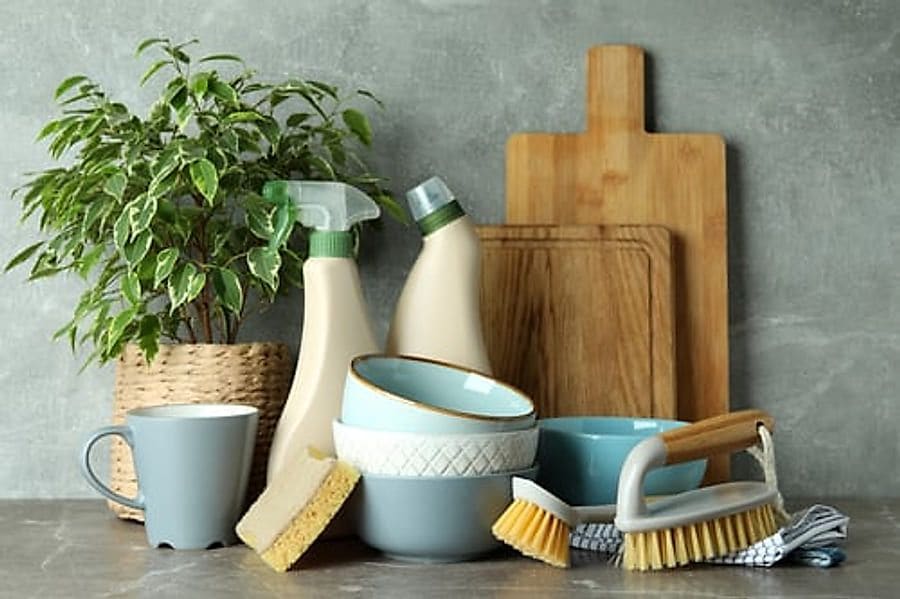 Tidy kitchen counter with cleaning supplies ready for a recurring cleaning visit